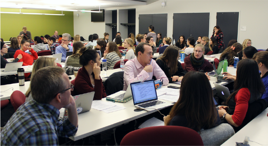 professor tim griffin speaks with a group of students about ideas to communicate to the UN representative, Orion Kobayashi